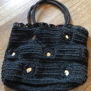 Lovely black woven bag with mirror accents.